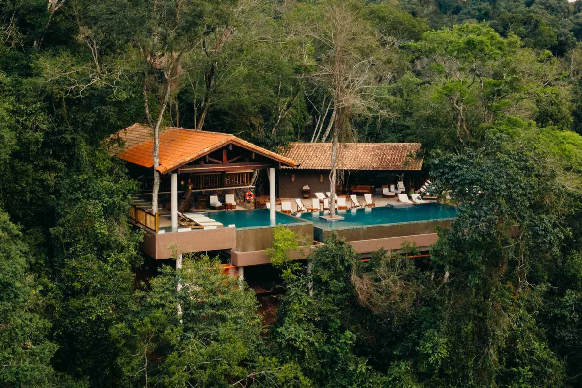The Loi Suites from the air, its pool and pavilion surrounded by jungle
